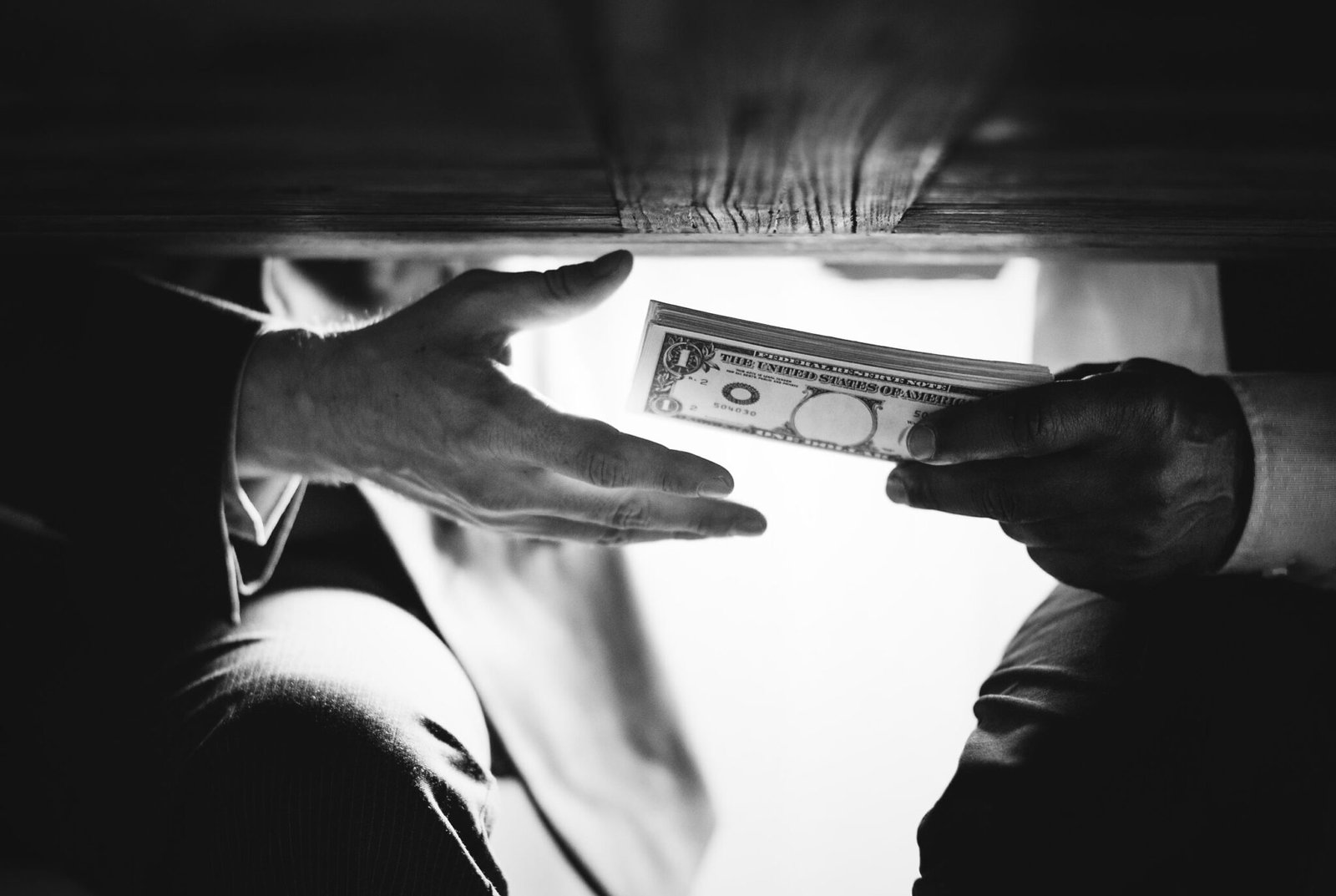 <a href="https://www.freepik.com/free-photo/hands-passing-money-table-corruption-bribery_18642905.htm#fromView=search&page=1&position=0&uuid=cae83097-eb45-4633-ac33-e0fdd879744b&query=Blocked+Funds%3A+Enhancing+Trust+and+Commitment+in+High-Value+Trade+Deals%E2%80%8B">Image by freepik</a>